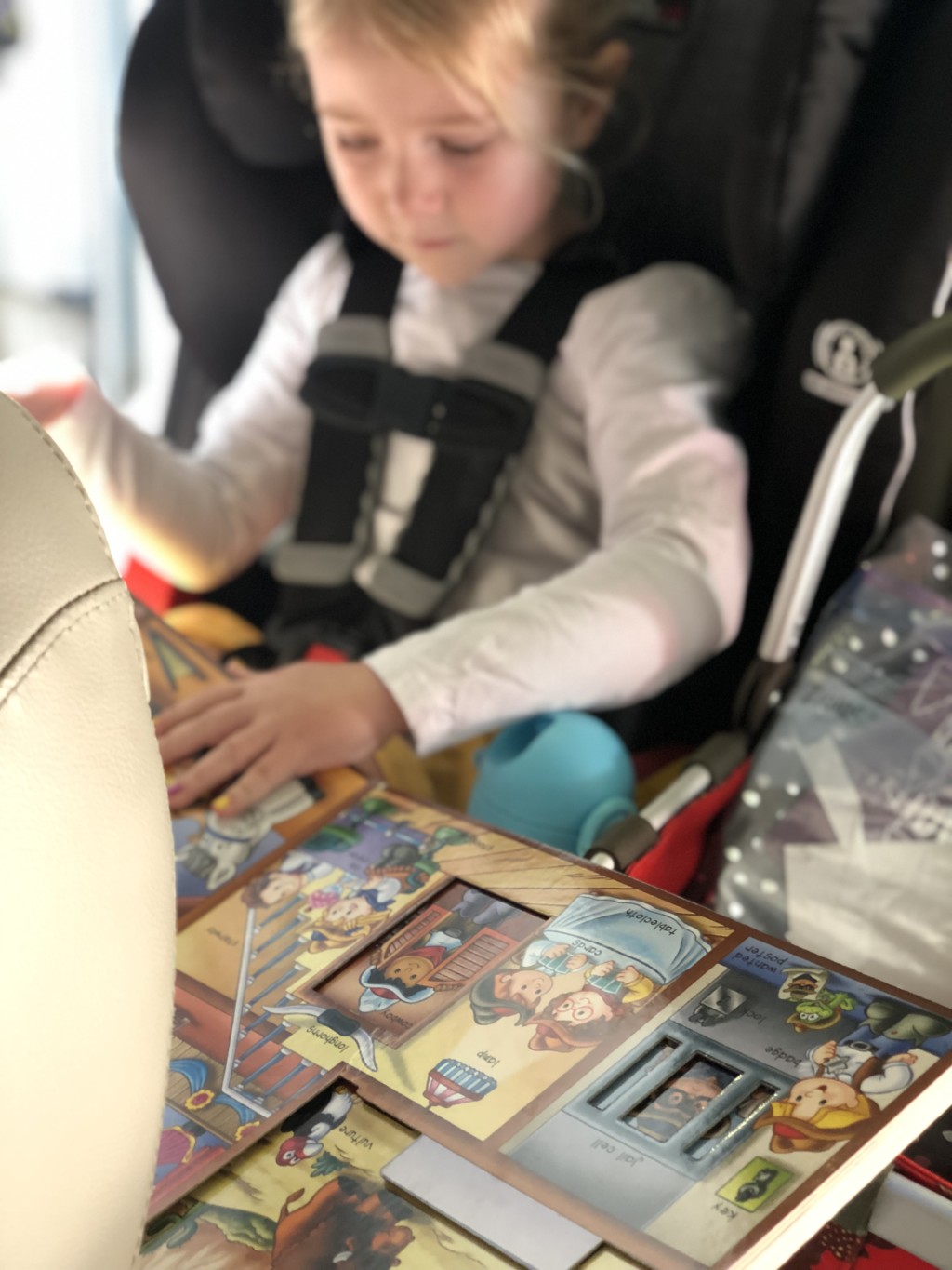 Child with book and toys