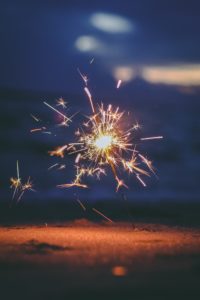 Sparklers lit at the beach create a nice ambience