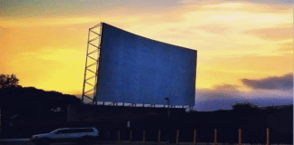 drive-in theater screen at dusk