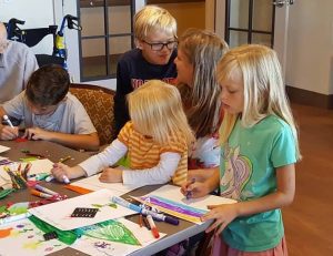 kids making cards for elderly