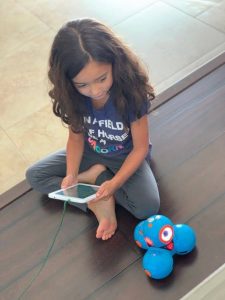 girl playing with robot