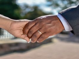 How to Help Storm Victims in Texas & Other States image of two hands holding each other