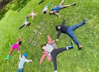 kids laying in grass at camp