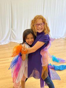 kids at seaside summer camp hugging