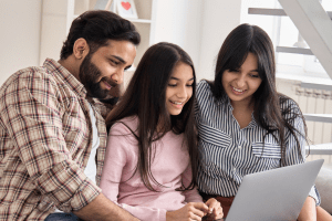 family reading on the computer together